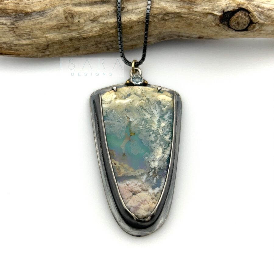 plume agate cabochon doublet set in sterling silver. with a white topaz gemstone